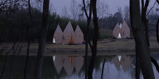 Wooden shingles overlay cluster of monolithic cabins